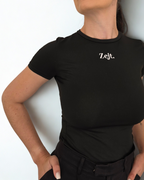 Person wearing a black t-shirt with 'Zejt.' logo on a white background