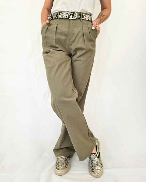 woman wearing sage green khaki linen pants dressed casual